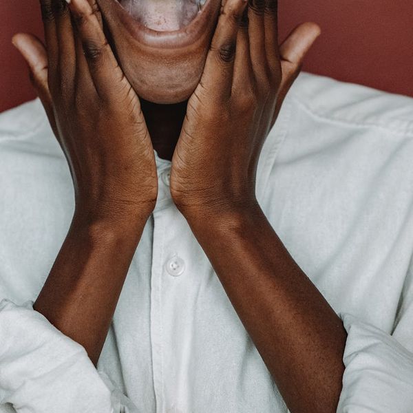 Smiling person feeling energetic after a light workout session.